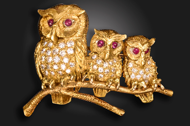 A gold owl brooch